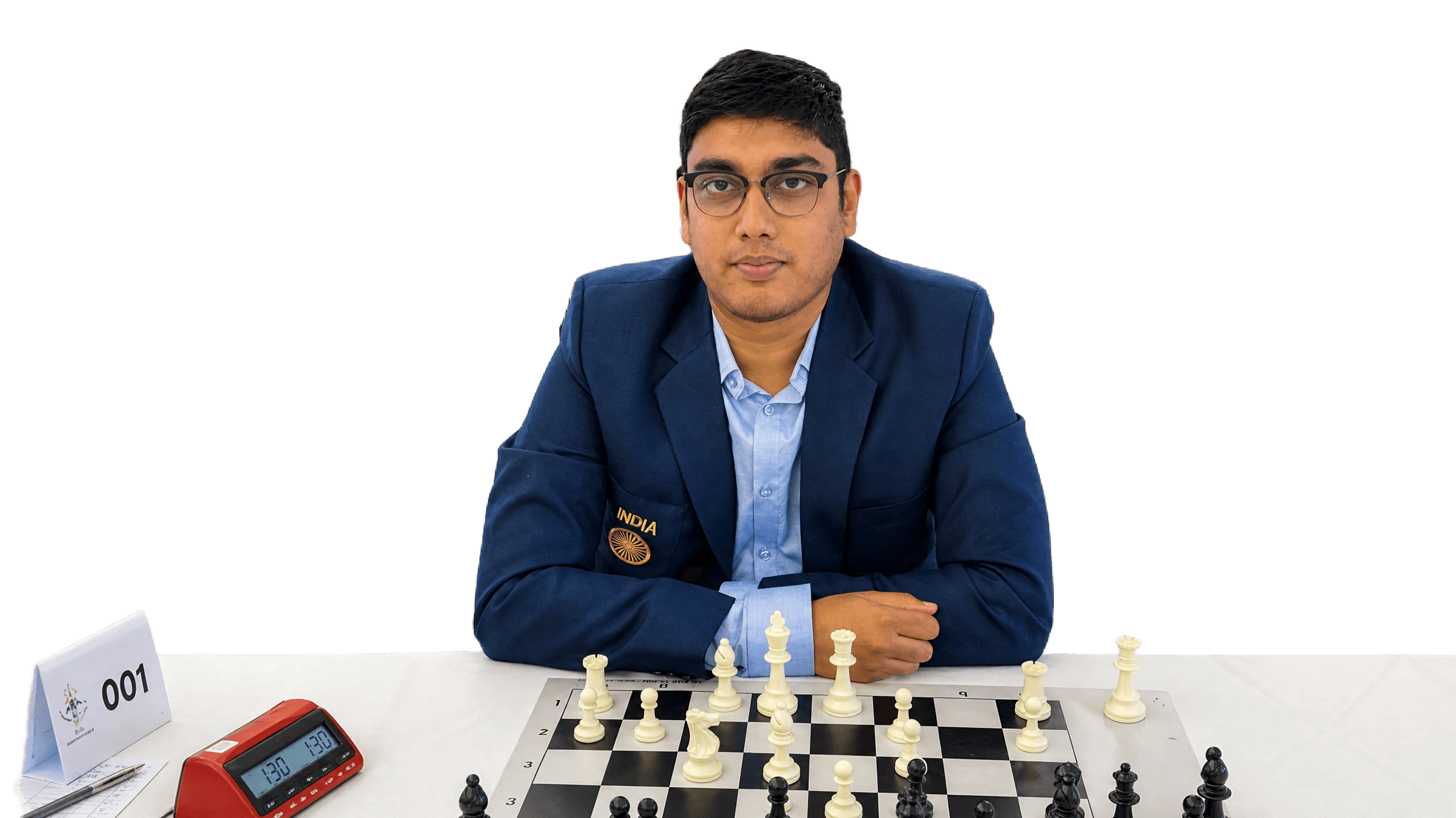 GM Swayams Mishra in the India team blazer, seated at a chess board
